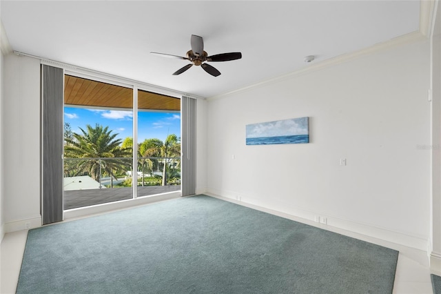 2251 Gulf Of Mexico Dr Unit 301, Longboat Key, FL 34228 - unfurnished room with a ceiling fan, crown molding, a smoke detector, carpet floors, and expansive windows