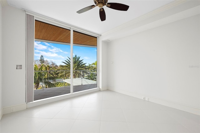 2251 Gulf Of Mexico Dr Unit 301, Longboat Key, FL 34228 - empty room with ceiling fan and expansive windows