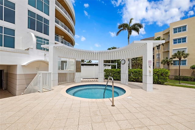 2251 Gulf Of Mexico Dr Unit 301, Longboat Key, FL 34228 - view of swimming pool featuring a pergola, a patio, and a community hot tub