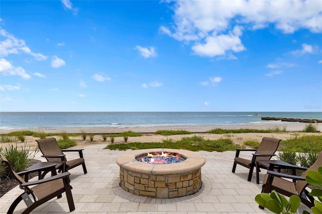 2251 Gulf Of Mexico Dr Unit 301, Longboat Key, FL 34228 - view of patio with a fire pit and view of water and beach