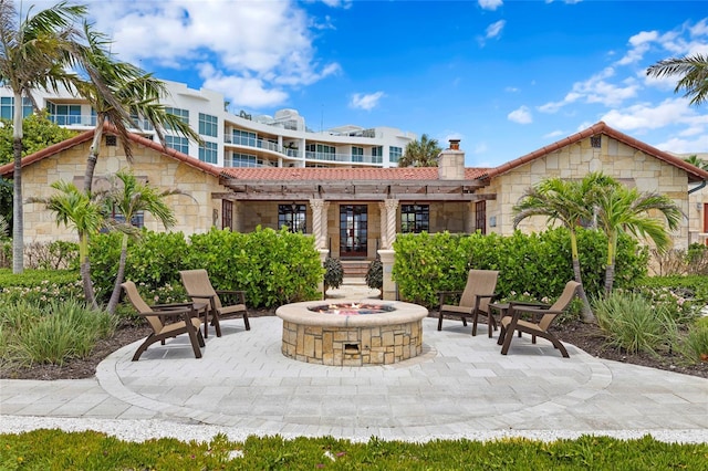 2251 Gulf Of Mexico Dr Unit 301, Longboat Key, FL 34228 - view of patio with a fire pit and french doors