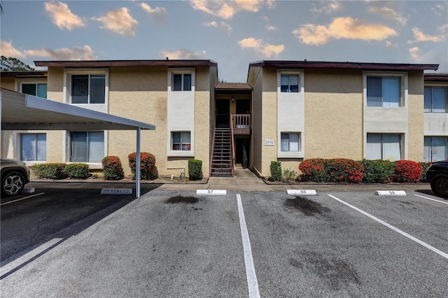 2716 Hidden Lake Blvd Unit C, Sarasota, FL 34237 - view of building exterior featuring uncovered parking and stairway