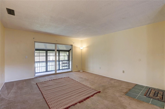 2716 Hidden Lake Blvd Unit C, Sarasota, FL 34237 - carpeted spare room with a textured ceiling