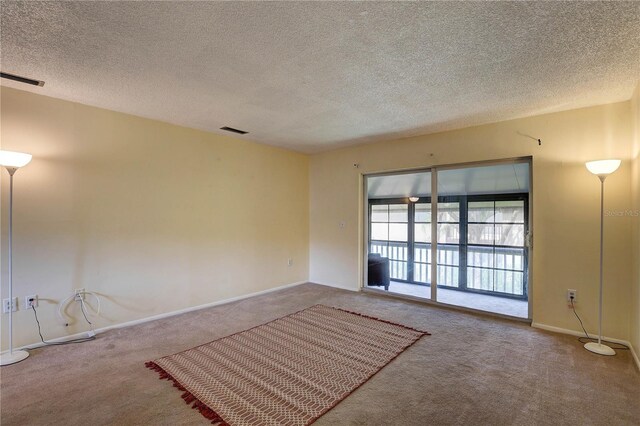 2716 Hidden Lake Blvd Unit C, Sarasota, FL 34237 - carpeted spare room with a textured ceiling and baseboards