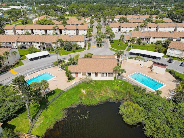 2716 Hidden Lake Blvd Unit C, Sarasota, FL 34237 - bird's eye view of a pool and a nearby body of water