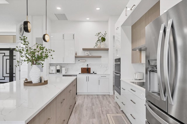 10270 Castanet Ave, Englewood, FL 34224 - kitchen with stainless steel appliances, modern cabinets, open shelves, decorative backsplash, and recessed lighting