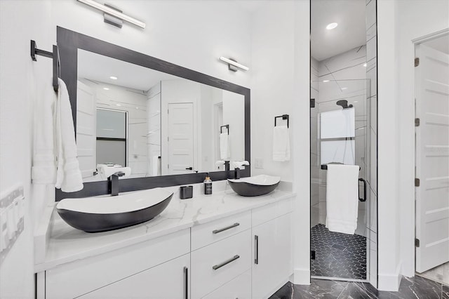 10270 Castanet Ave, Englewood, FL 34224 - bathroom featuring marble finish flooring, double vanity, a shower stall, and recessed lighting