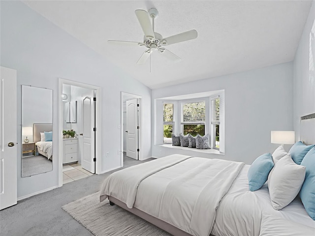 3223 Jamaica St, Sarasota, FL 34231 - bedroom featuring light carpet, lofted ceiling, ceiling fan, and ensuite bathroom