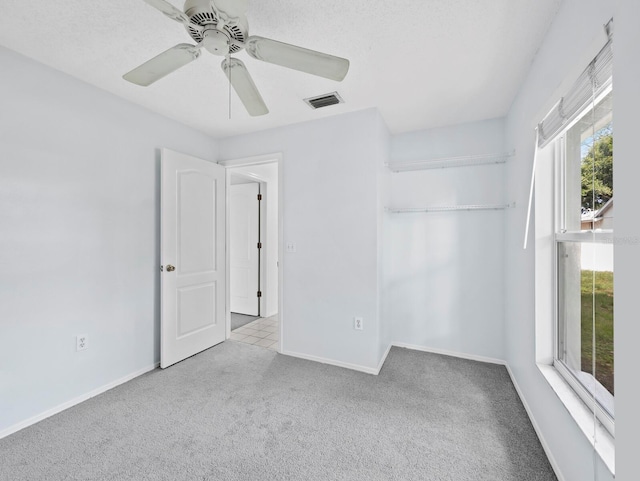 3223 Jamaica St, Sarasota, FL 34231 - unfurnished bedroom with carpet floors, a closet, and ceiling fan