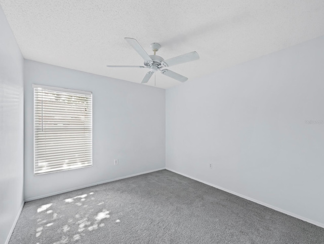 3223 Jamaica St, Sarasota, FL 34231 - carpeted empty room featuring a ceiling fan and a textured ceiling
