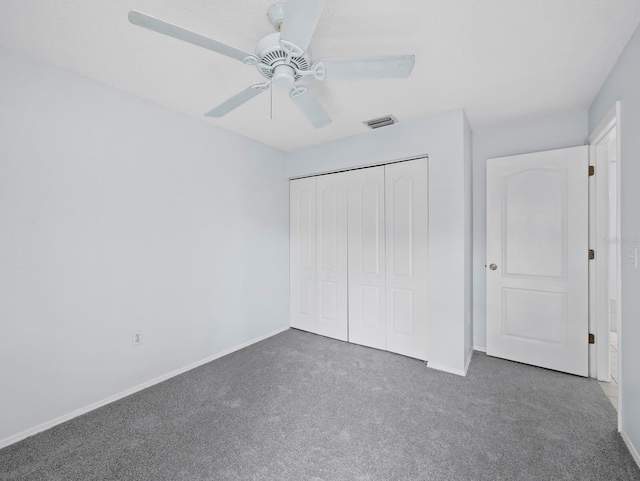3223 Jamaica St, Sarasota, FL 34231 - unfurnished bedroom featuring carpet, a closet, and ceiling fan