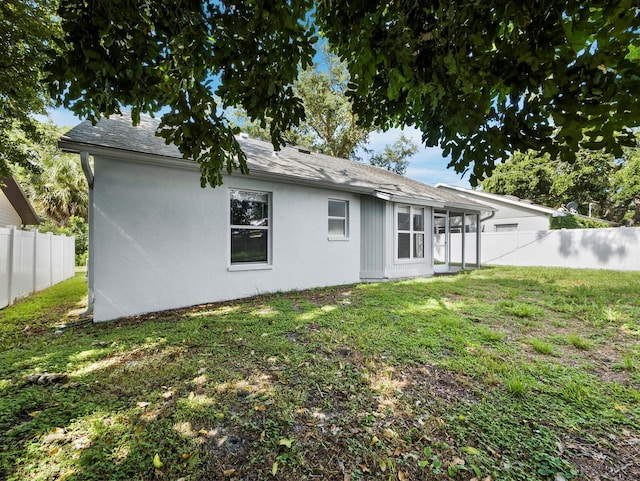 3223 Jamaica St, Sarasota, FL 34231 - back of house featuring stucco siding