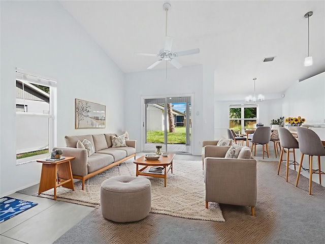 3223 Jamaica St, Sarasota, FL 34231 - living area featuring a chandelier, a ceiling fan, and high vaulted ceiling