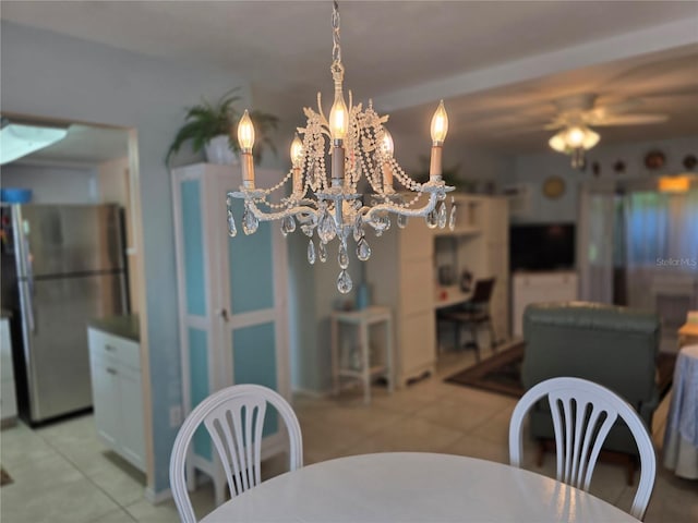 5850 Welcome Rd Unit J6, Bradenton, FL 34207 - dining area with tile patterned flooring, a chandelier, and a ceiling fan