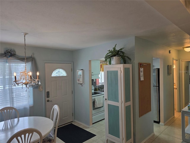5850 Welcome Rd Unit J6, Bradenton, FL 34207 - entryway featuring a chandelier and light tile patterned floors