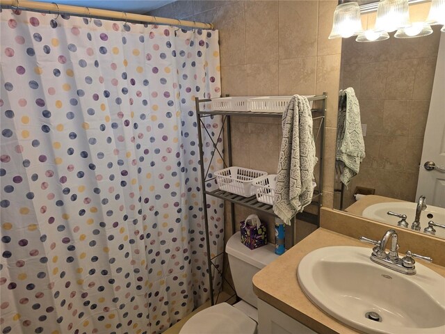 5850 Welcome Rd Unit J6, Bradenton, FL 34207 - full bathroom with tile walls, vanity, and a shower with shower curtain