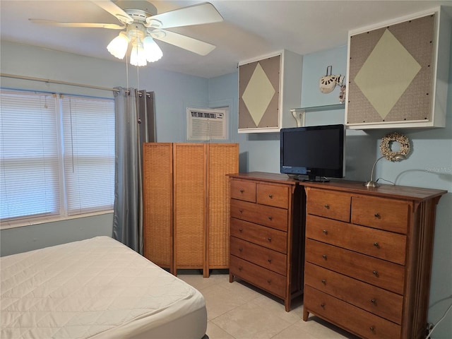 5850 Welcome Rd Unit J6, Bradenton, FL 34207 - bedroom with a wall mounted air conditioner, light tile patterned floors, ceiling fan, and an office area