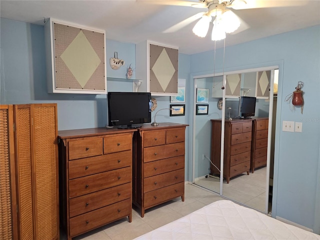 5850 Welcome Rd Unit J6, Bradenton, FL 34207 - bedroom featuring a desk, light tile patterned flooring, a ceiling fan, and a closet