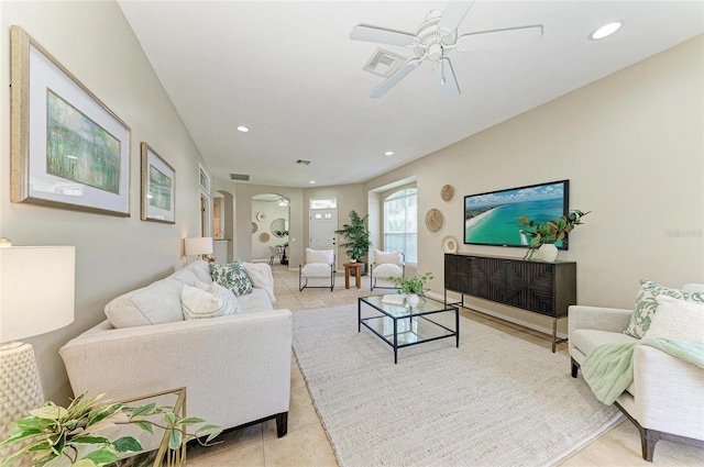 7039 Woodmore Ter, Lakewood Ranch, FL 34202 - living area with a ceiling fan, recessed lighting, light tile patterned floors, and arched walkways