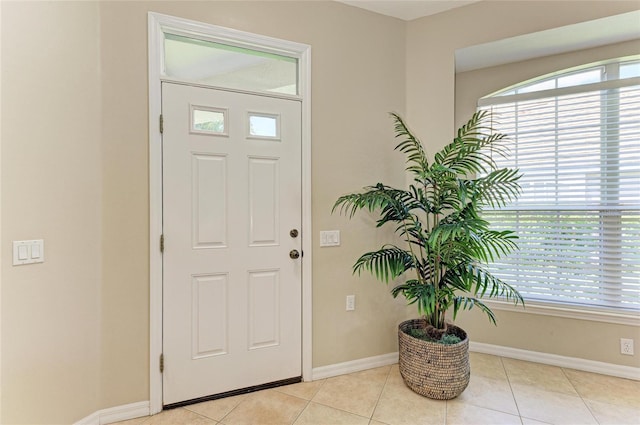 7039 Woodmore Ter, Lakewood Ranch, FL 34202 - foyer entrance featuring baseboards and light tile patterned floors