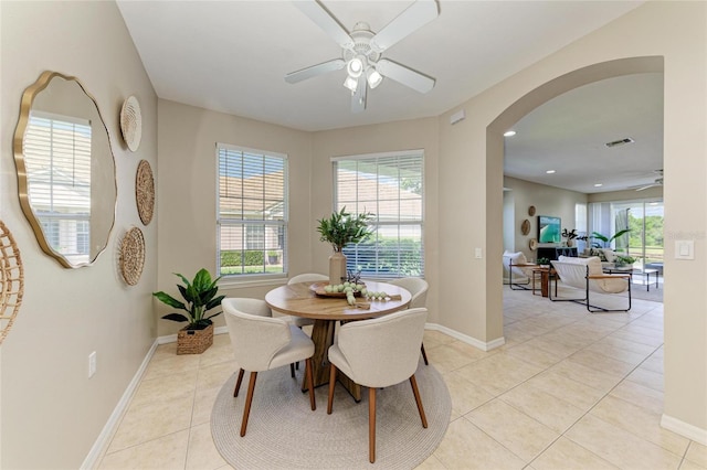 7039 Woodmore Ter, Lakewood Ranch, FL 34202 - dining area with ceiling fan, arched walkways, light tile patterned floors, and recessed lighting