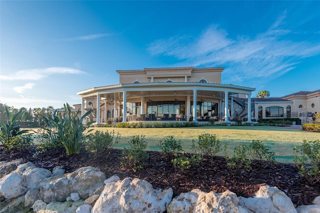 7039 Woodmore Ter, Lakewood Ranch, FL 34202 - back of house featuring a yard and a patio area