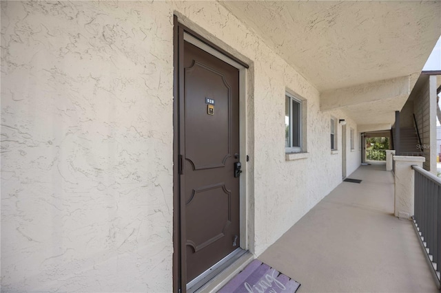 2220 Stickney Point Rd Unit 528, Sarasota, FL 34231 - view of exterior entry featuring stucco siding