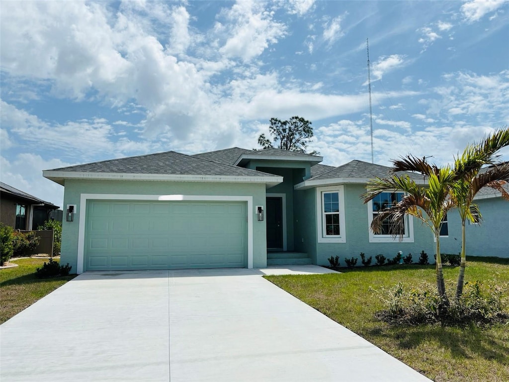 152 White Pine Dr, Rotonda West, FL 33947 - single story home featuring stucco siding, a garage, concrete driveway, and a front yard