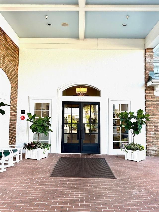6713 Stone River Rd Unit 101, Bradenton, FL 34203 - view of exterior entry with french doors and stucco siding