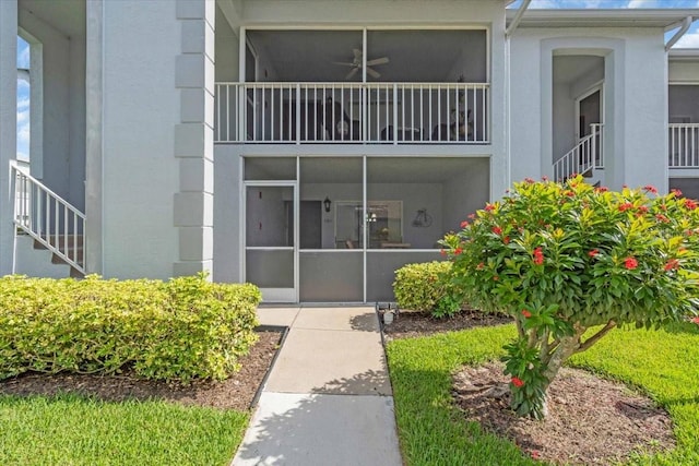 6713 Stone River Rd Unit 101, Bradenton, FL 34203 - property entrance with ceiling fan and stucco siding