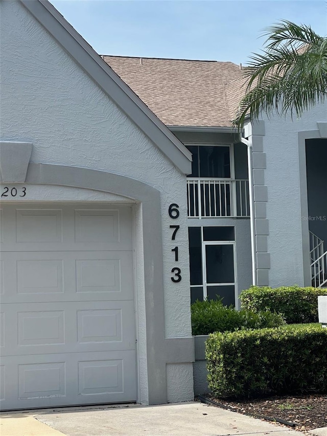 6713 Stone River Rd Unit 101, Bradenton, FL 34203 - entrance to property featuring stucco siding and roof with shingles