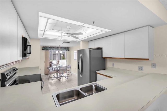 6713 Stone River Rd Unit 101, Bradenton, FL 34203 - kitchen featuring electric range, stainless steel fridge with ice dispenser, black microwave, light countertops, and white cabinetry