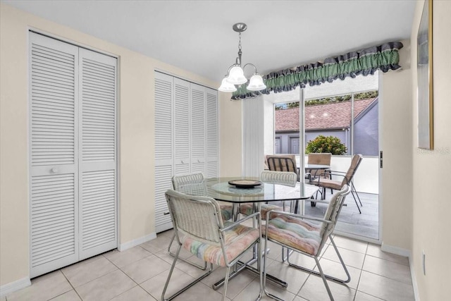 6713 Stone River Rd Unit 101, Bradenton, FL 34203 - dining space with a chandelier and light tile patterned floors