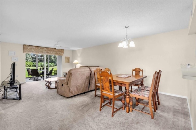 6713 Stone River Rd Unit 101, Bradenton, FL 34203 - carpeted dining space featuring a chandelier