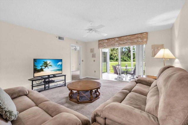 6713 Stone River Rd Unit 101, Bradenton, FL 34203 - carpeted living area featuring a ceiling fan and baseboards