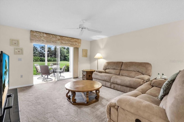 6713 Stone River Rd Unit 101, Bradenton, FL 34203 - carpeted living area featuring a ceiling fan and baseboards