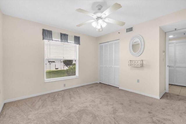6713 Stone River Rd Unit 101, Bradenton, FL 34203 - unfurnished bedroom with carpet flooring, a closet, and a ceiling fan