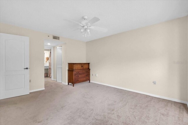 6713 Stone River Rd Unit 101, Bradenton, FL 34203 - unfurnished bedroom featuring carpet flooring and ceiling fan