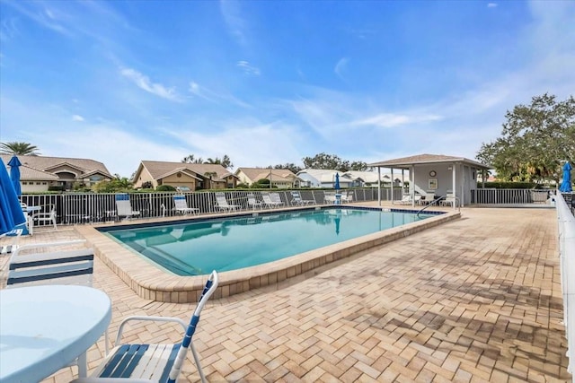 6713 Stone River Rd Unit 101, Bradenton, FL 34203 - community pool with a patio and a residential view