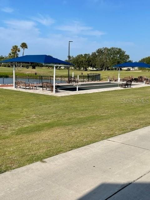 6713 Stone River Rd Unit 101, Bradenton, FL 34203 - view of home's community with a lawn