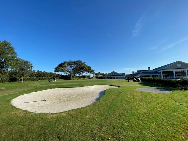 6713 Stone River Rd Unit 101, Bradenton, FL 34203 - view of property's community with a lawn