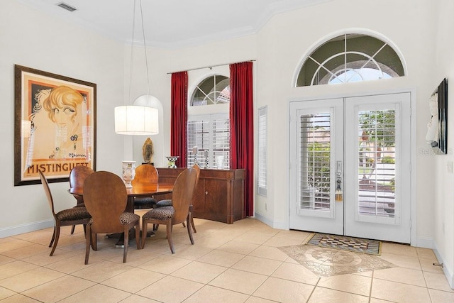 471 Park Trace Blvd, Osprey, FL 34229 - dining area featuring french doors, light tile patterned floors, and crown molding