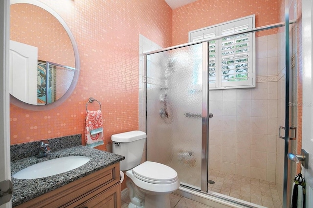 471 Park Trace Blvd, Osprey, FL 34229 - bathroom featuring vanity, a stall shower, wallpapered walls, and tile patterned flooring