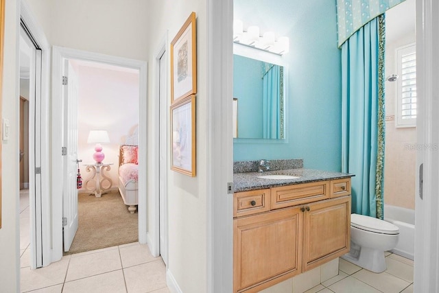 471 Park Trace Blvd, Osprey, FL 34229 - ensuite bathroom featuring tile patterned flooring, vanity, and shower / bath combo with shower curtain