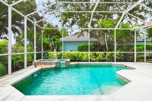 471 Park Trace Blvd, Osprey, FL 34229 - view of swimming pool featuring glass enclosure, a patio area, and a pool with connected hot tub