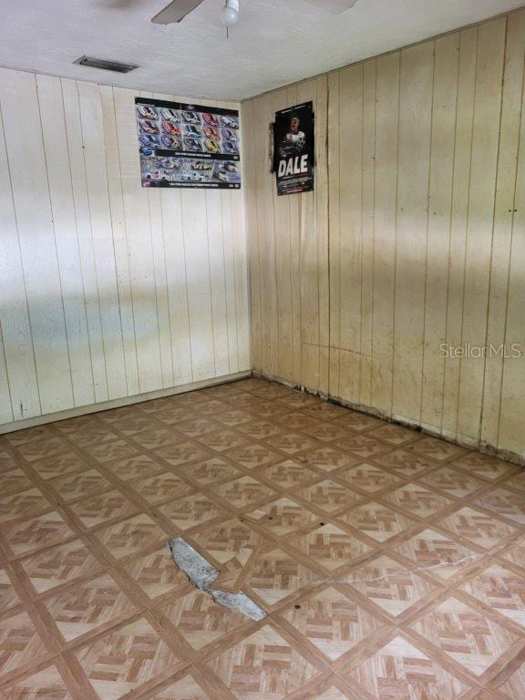 2532 Grand Cayman St, Sarasota, FL 34231 - empty room with wood walls