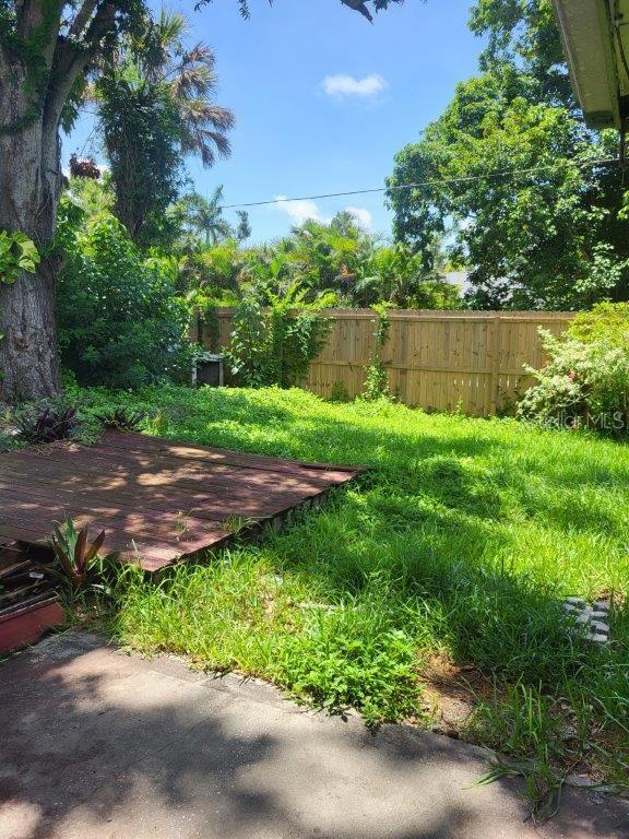 2532 Grand Cayman St, Sarasota, FL 34231 - view of yard with a wooden deck