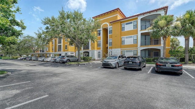 8397 38th Street Cir E Unit 306, Sarasota, FL 34243 - view of building exterior featuring uncovered parking