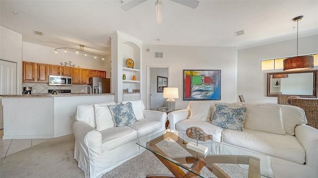8397 38th Street Cir E Unit 306, Sarasota, FL 34243 - living area with a ceiling fan, light carpet, ornamental molding, and light tile patterned floors