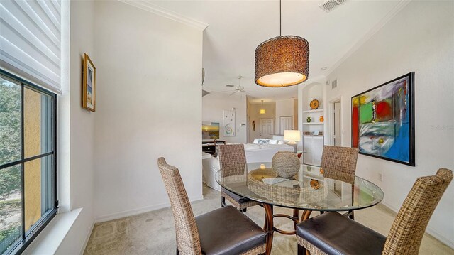 8397 38th Street Cir E Unit 306, Sarasota, FL 34243 - dining room with carpet flooring, crown molding, and built in features